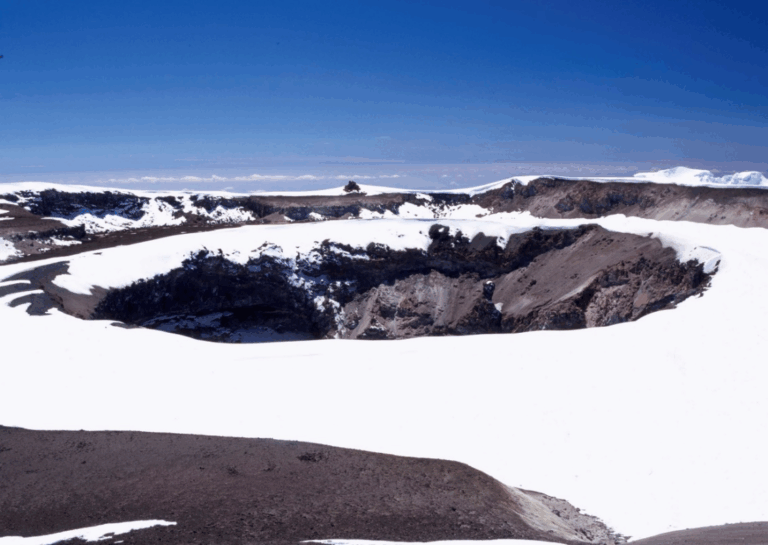 Glacial snow and ice covering the crater rim of Mount Kilimanjaro during dry season ascent | Kili Quests