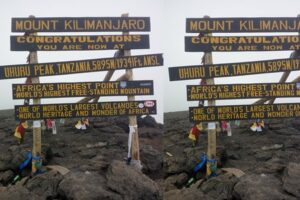 Uhuru Peak signboard on Mount Kilimanjaro showing the summit elevation at 5,895 meters | Kili Quests