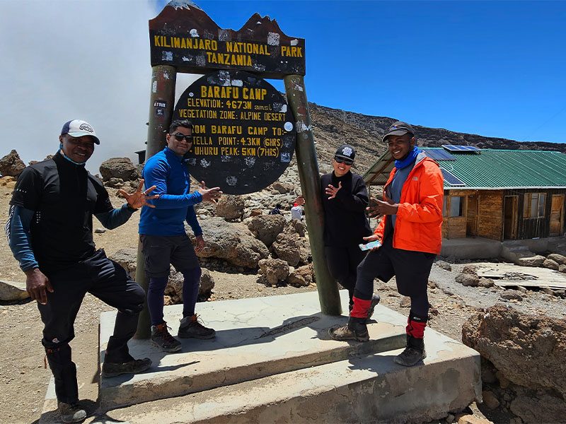 Climbers at Barafu Camp (4,673m) on Mount Kilimanjaro’s Northern Circuit Route, preparing for the final summit push to Uhuru Peak | Kili Quests
