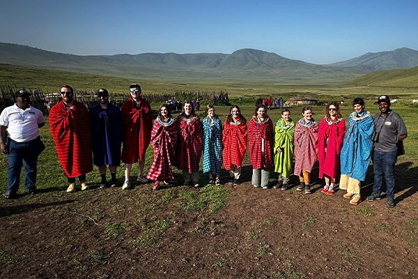 Kili Quests staff visiting a Maasai boma during a cultural experience in northern Tanzania