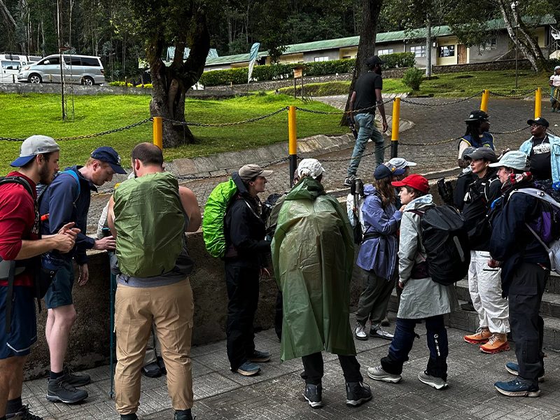 Trekkers registering at Kilimanjaro National Park gate before the climb