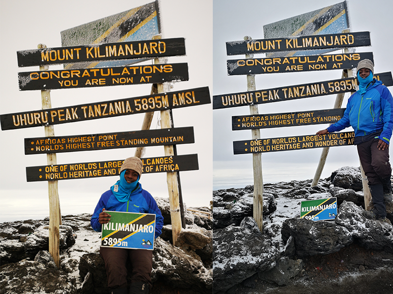 Trekkers posing at the Uhuru Peak summit sign on Mount Kilimanjaro, marking Africa’s highest point at 5,895 meters.