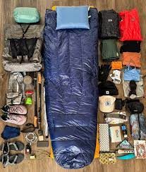 Trekker checking boots and equipment before climbing Kilimanjaro | Kili Quests